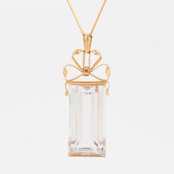 A chain and a pendant set with step-cut quartz.
