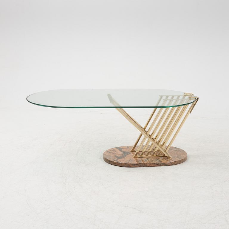 A glass, brass and stone coffee table, 1980's.