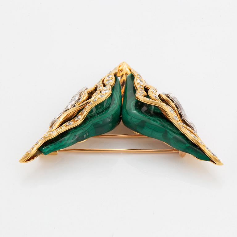 An 18K gold and malachite brooch and pair of earrings set with round brilliant-cut diamonds.