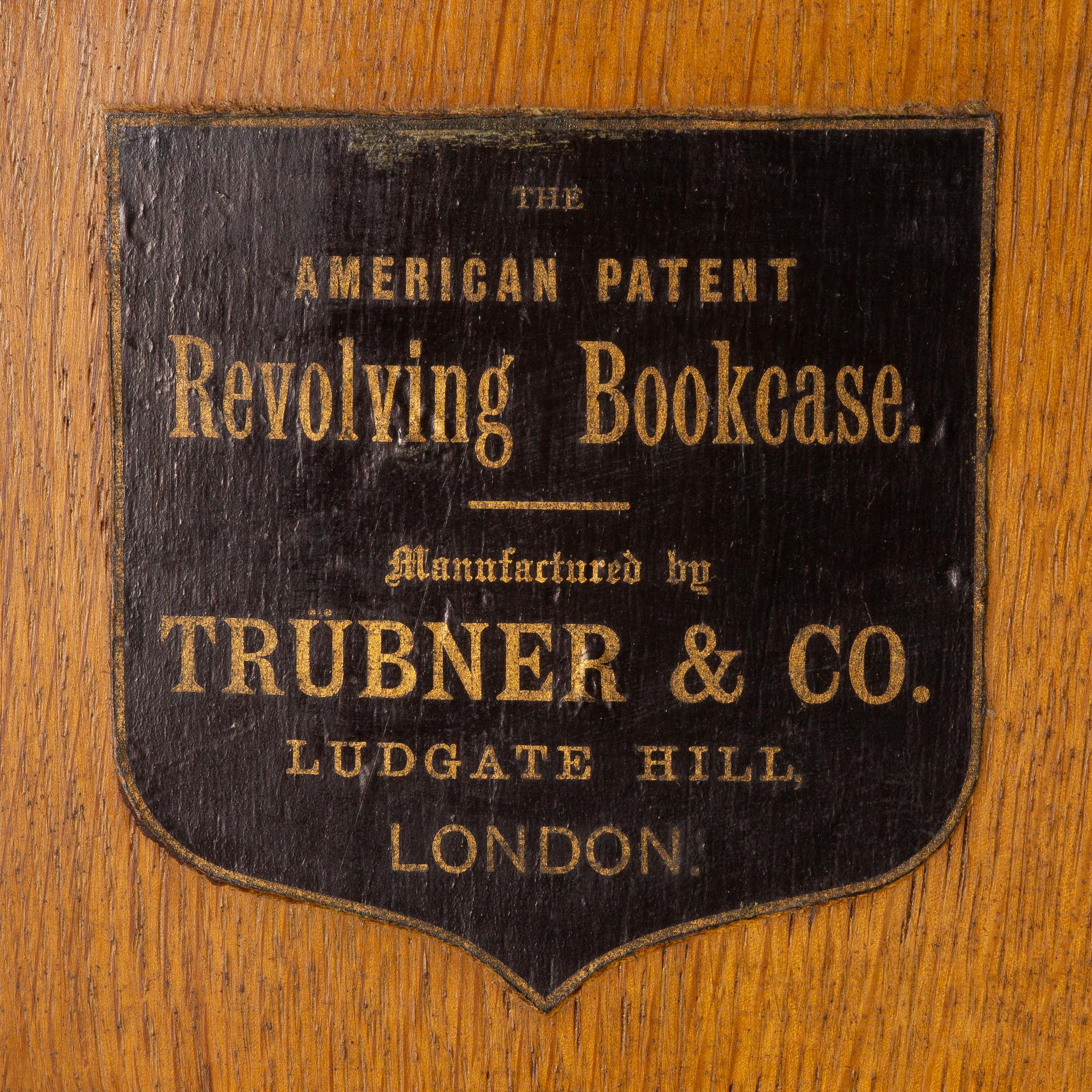 An oak Revolving bookcase by Trübner & Co, England, early 20th century.