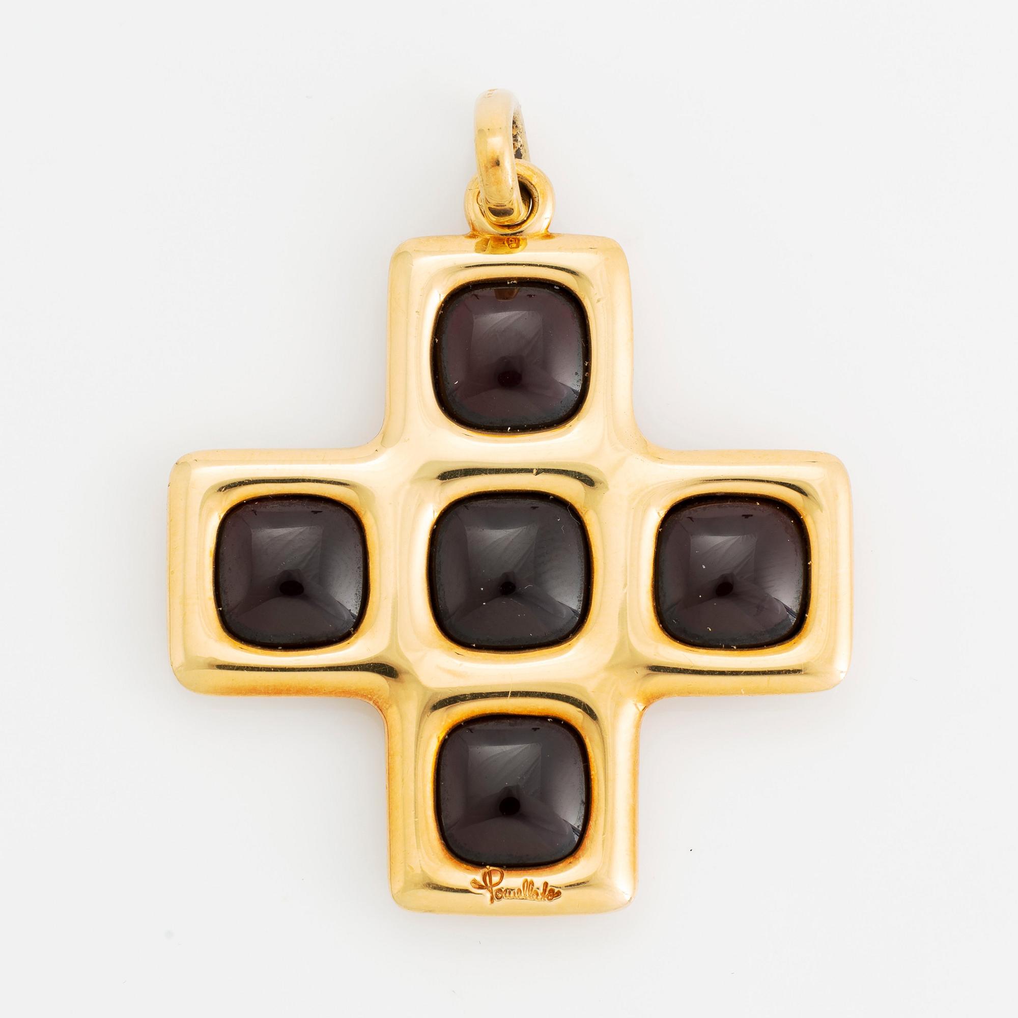 An 18K gold and garnet Pomellato cross.