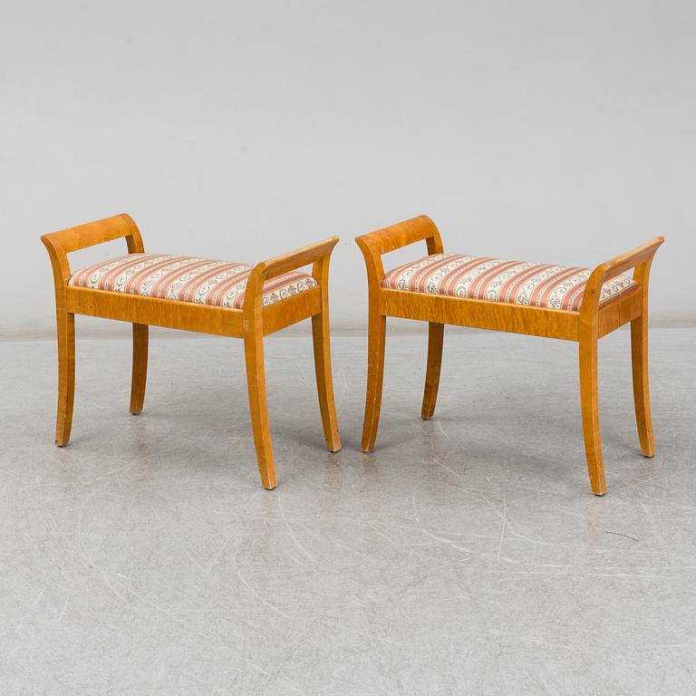 a pair of stools from the first half of the 20th century.