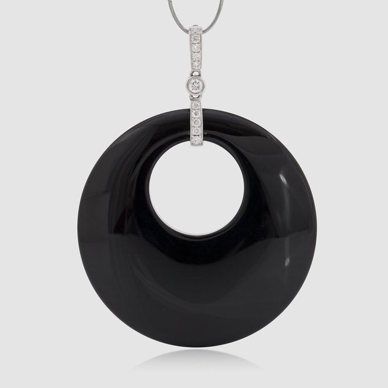 An onyx and brilliant-cut diamond pendant.