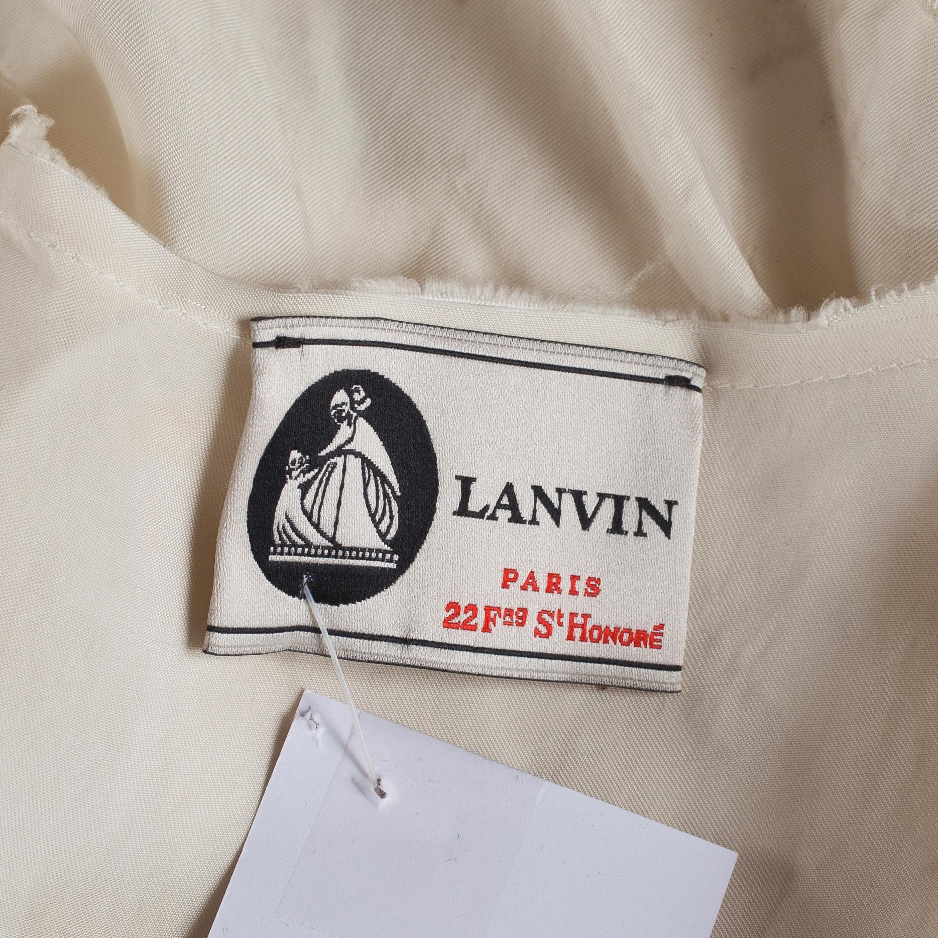 A white silk cocktail dress by Lanvin.