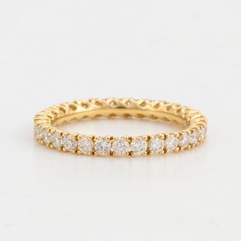 Brilliant-cut diamond eternity ring.