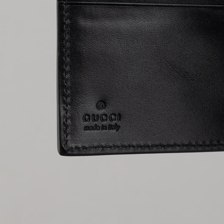 Gucci, väska och plånbok.