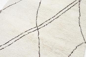 A Moroccan carpet, c. 282 x 150 cm.