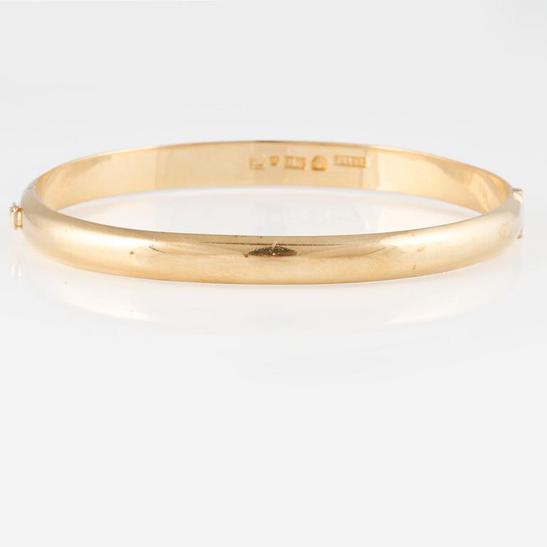 ARMRING, 18K guld, Ossner & Larsson, Göteborg, 1958. Vikt 30,5 gram.