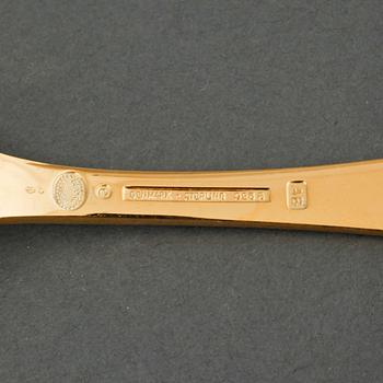 GEORG JENSEN, årsskedar, 19 st, förgyllt silver, samt årssked och gaffel, A. Michelsen, förgyllt silver, 1970-/80-tal.
