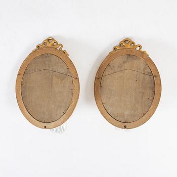 A pair of gilt Gustavian style mirror wall sconces, 20th Century.