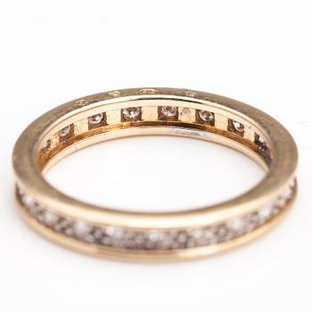 A 14K gold ring with diamonds ca. 0.21 ct in total. Timantttiset, Helsinki 2002.