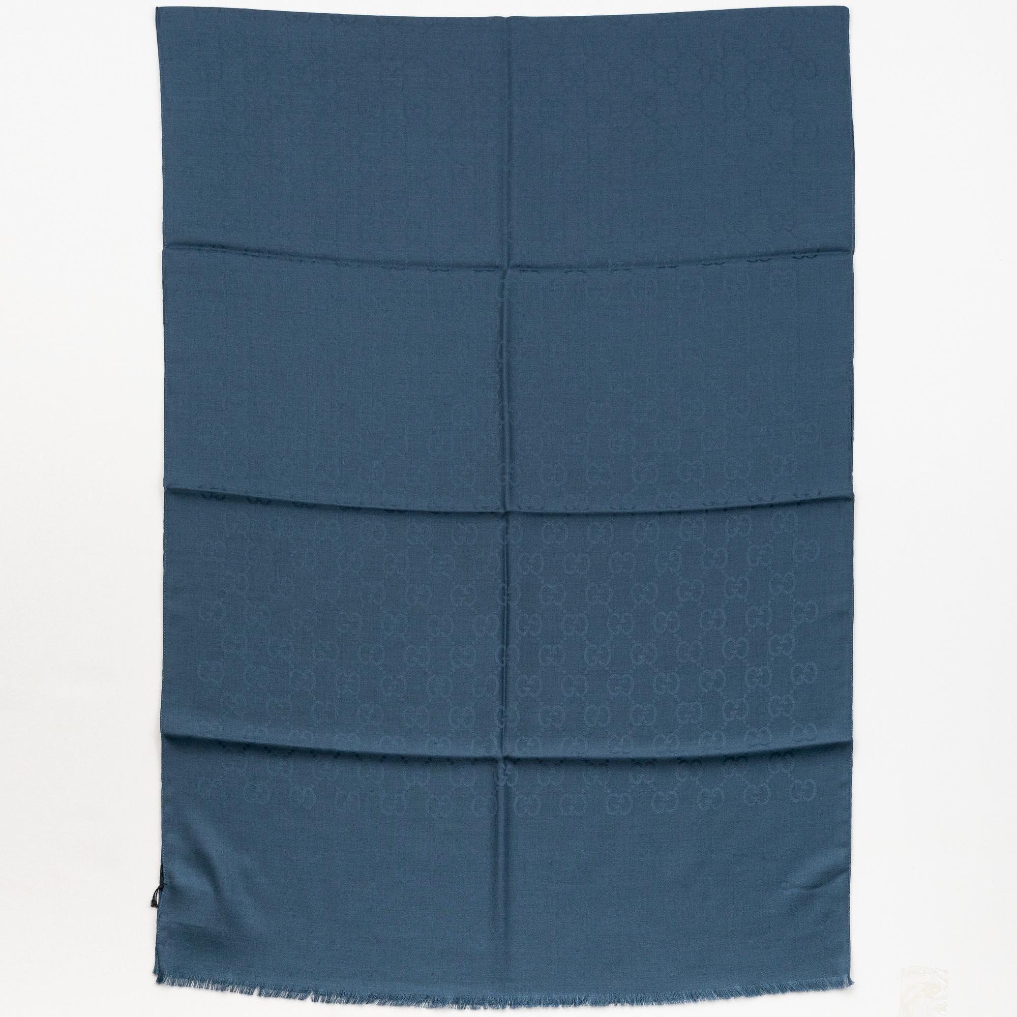 Gucci, a wool and silk mix "GG" jaquard shawl.