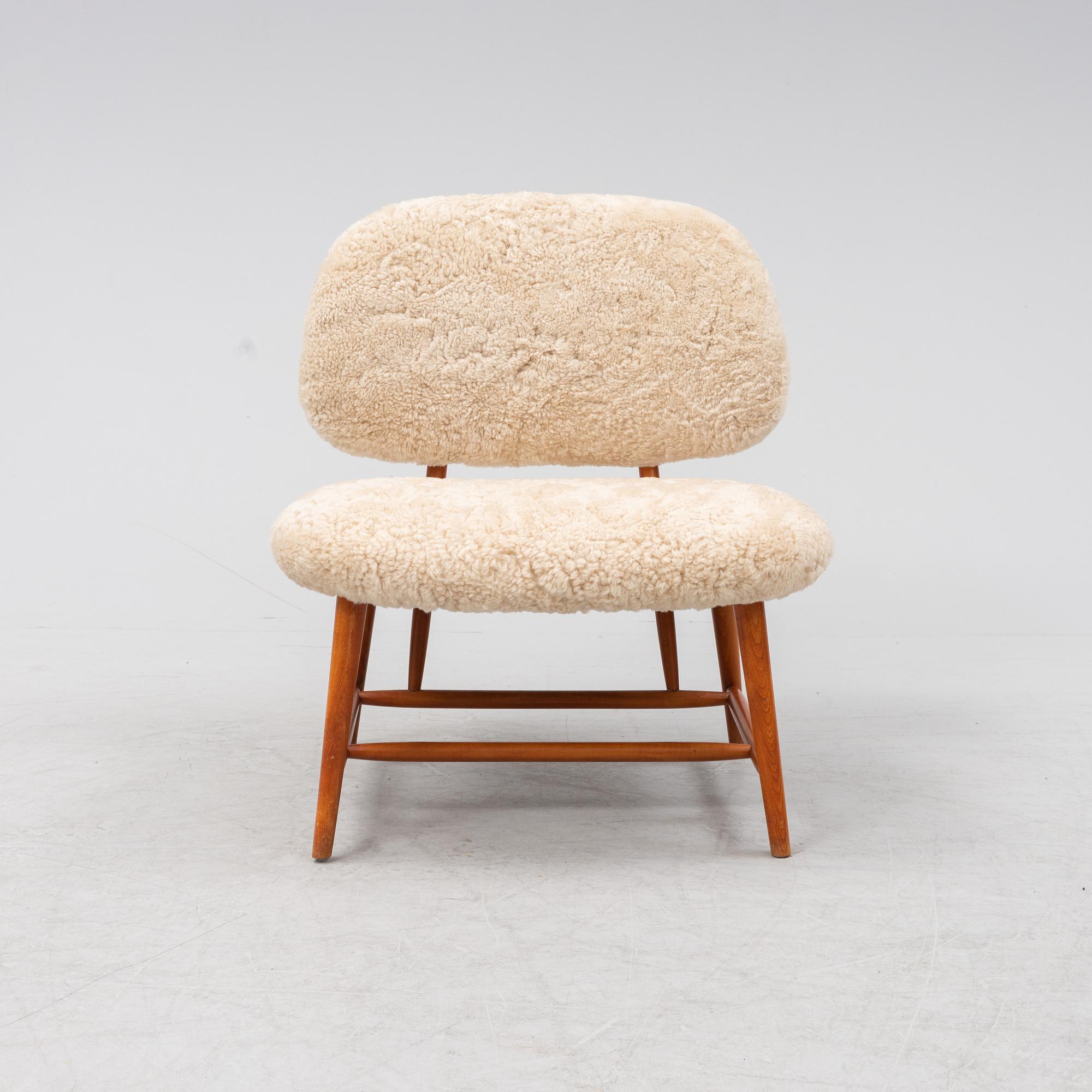 A TeVe easy chair by Alf Svensson, with new sheepskin upholstery, Studio Ljungs Industrier, 1950's.
