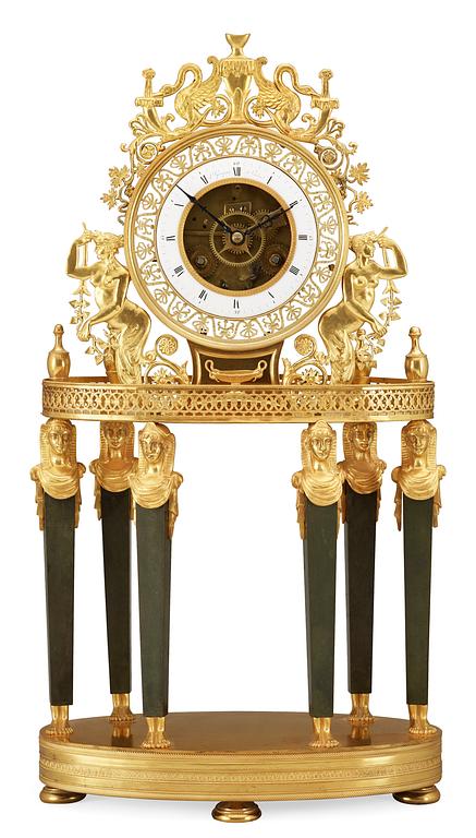 A French Empire gilt bronze mantel clock by L Grognot.