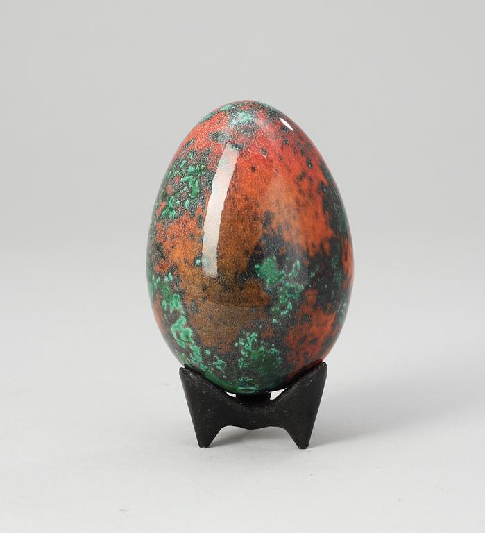 A Hans Hedberg faience egg on an iron base, Biot, France.