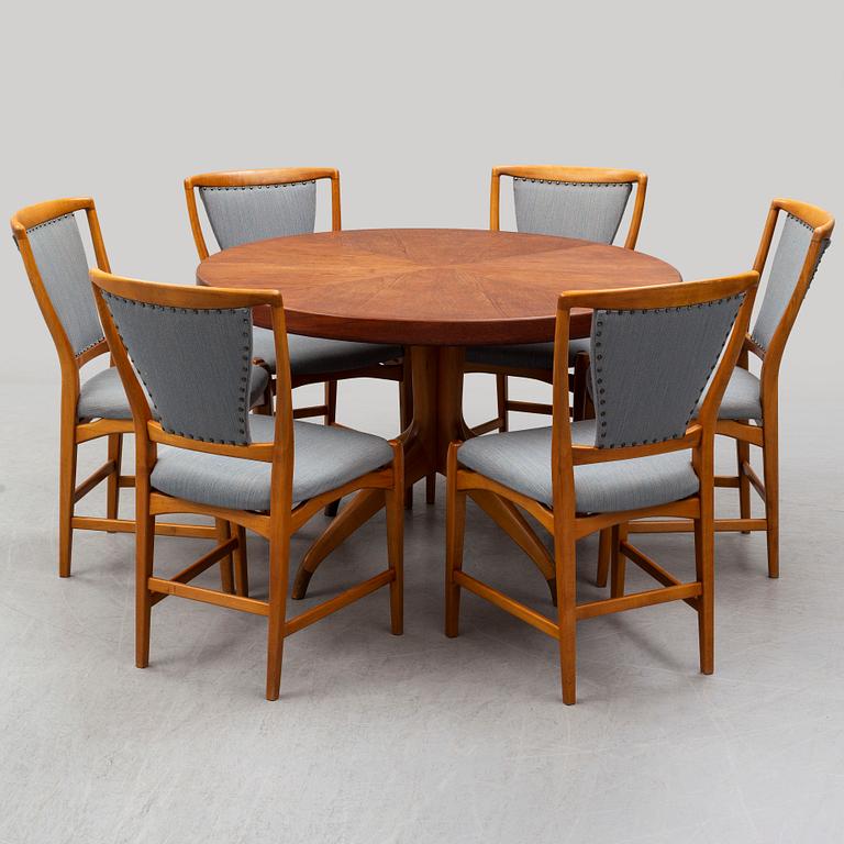 A teak and beech dining table and 6 chairs. Mid 20th century.