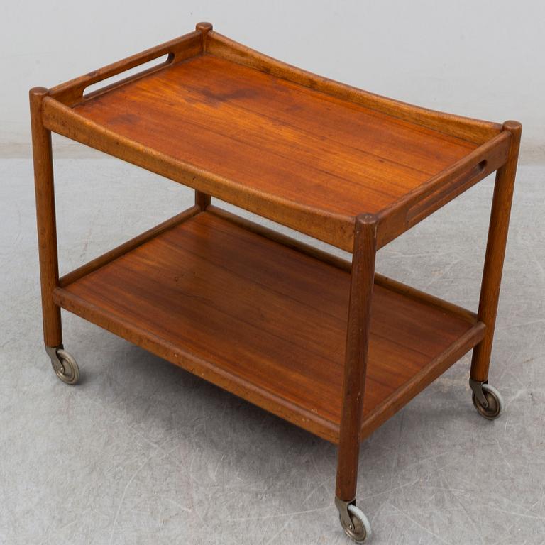 A signed tea trolley by Hans J Wegner for Andreas Tuck, Denmark, mid 20th century.