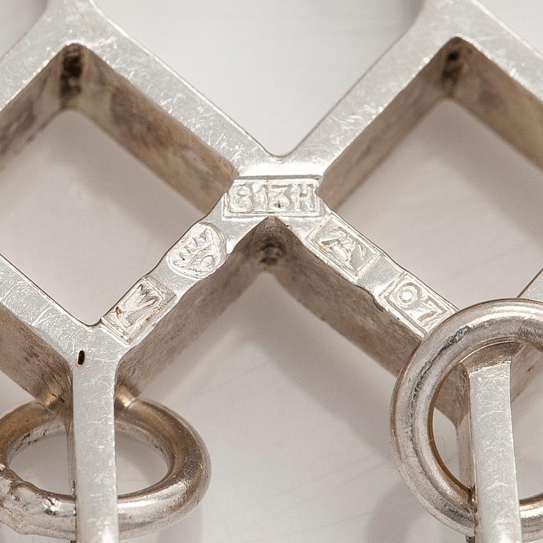 Jorma Laine, a set of two silver pendants, a bracelet and a brooch. Kultateollisuus Oy, Turku 1965-1972.