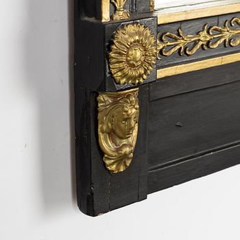 An Empire mirror by Jonas Frisk (Stockholm 1805-1824), and a later console table.
