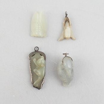 A group of eight Chinese stone charms / pendants, 20th century.