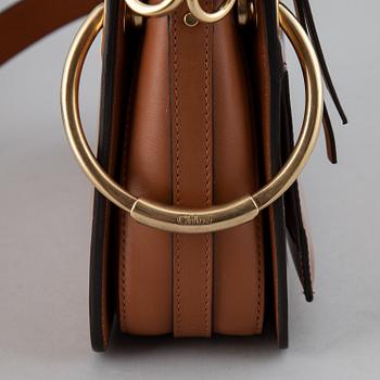 CHLOÉ, a small caramel 'Roy bag'.