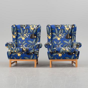 A pair of easychairs "Oxford", model 3543, by Ragnar Helsén for Firma Svenskt Tenn.