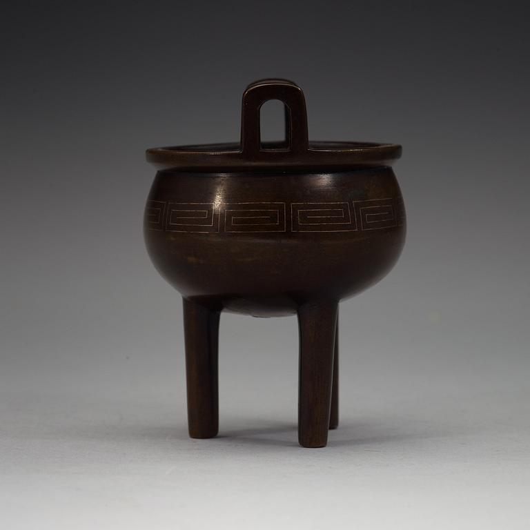 A bronze tripod censer, Qing dynasty, 19th Century with Xuandes six character mark.