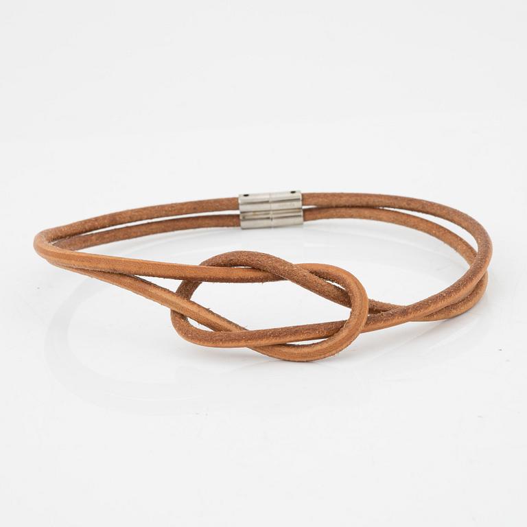 Hermès, a 'Atamé' leather knot necklace.