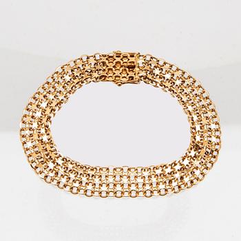 An 18K gold x-link bracelet.