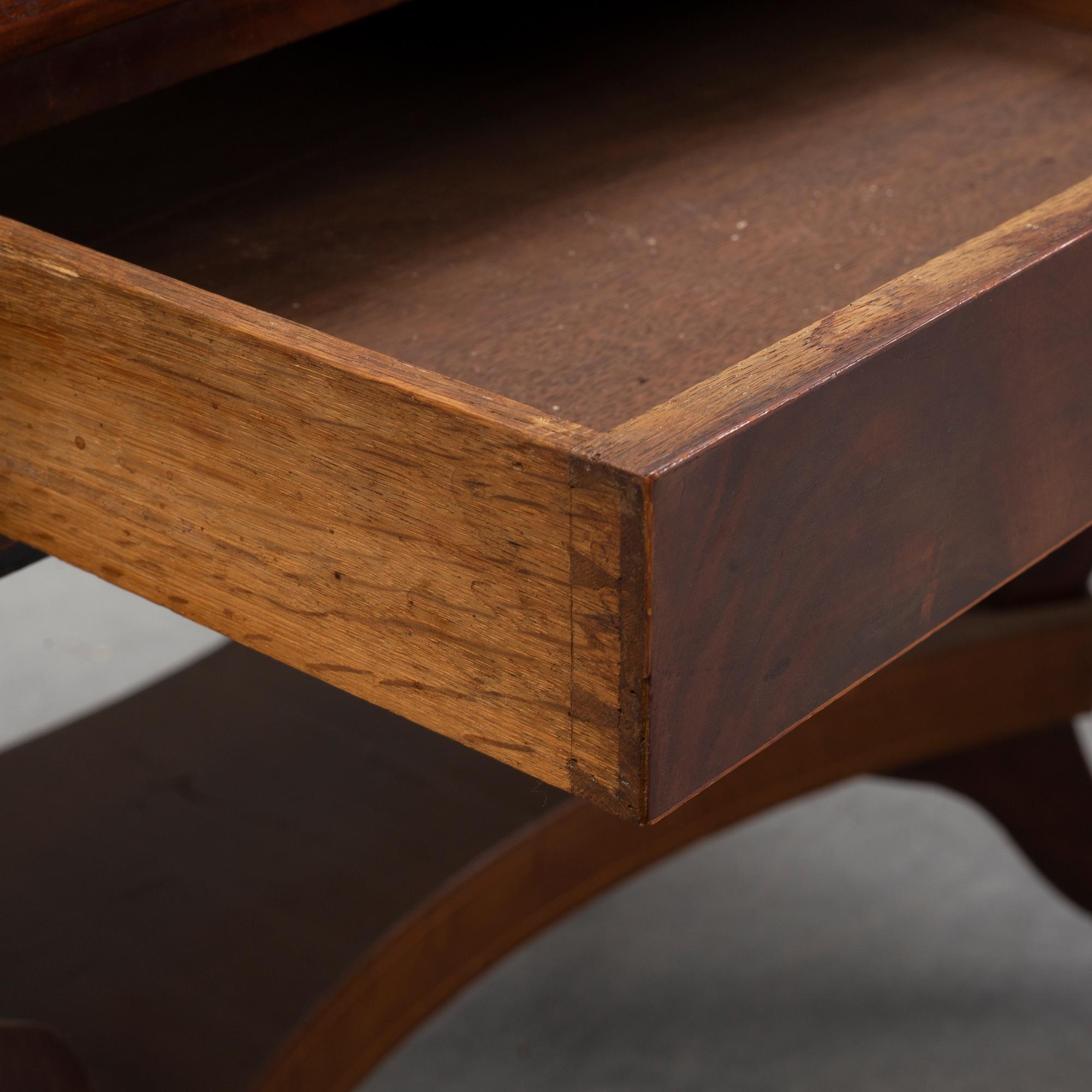 An Empire style mahogany  center table from around the year 1900.