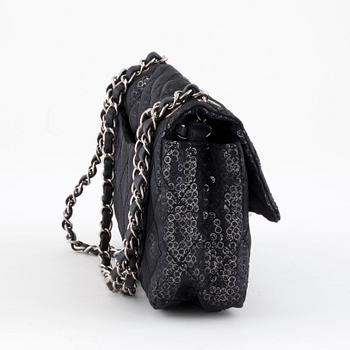 CHANEL, a black and silver tinsel evening "Flap-bag".