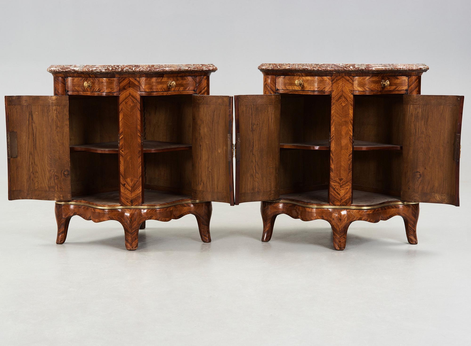 A pair of Louis XV 18th century corner cupboards.