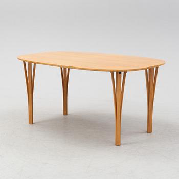 Bruno Mathsson & Piet Hein, a beech tree 'Superellips' dining table, Fritz Hansen, 1983.