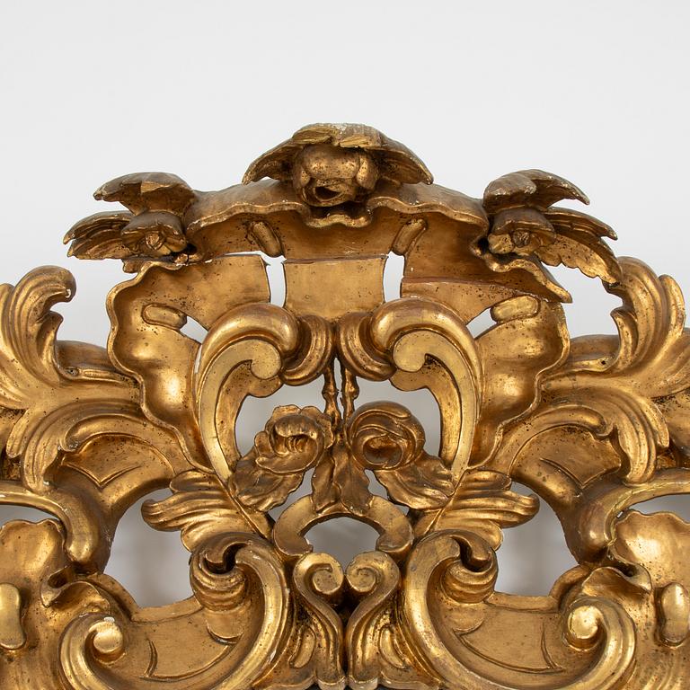 A large rococo-revival gilt-gesso mirror, later part 19th century.