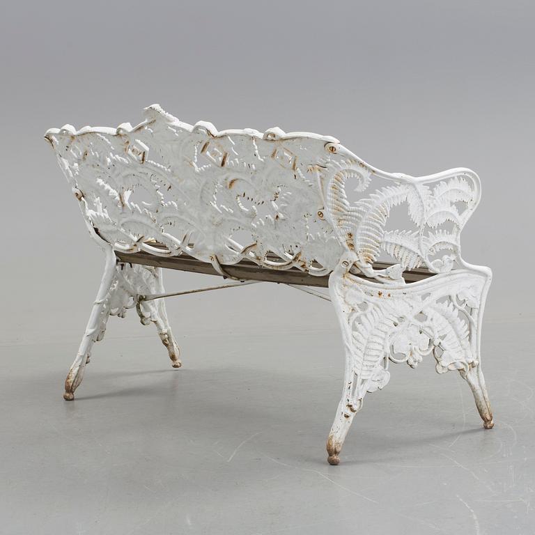 A WHITEPAINTED EARLY 20TH CENTURY SWEDISH AGGENBERG CAST IRON AND WOOD GARDEN SOFA.