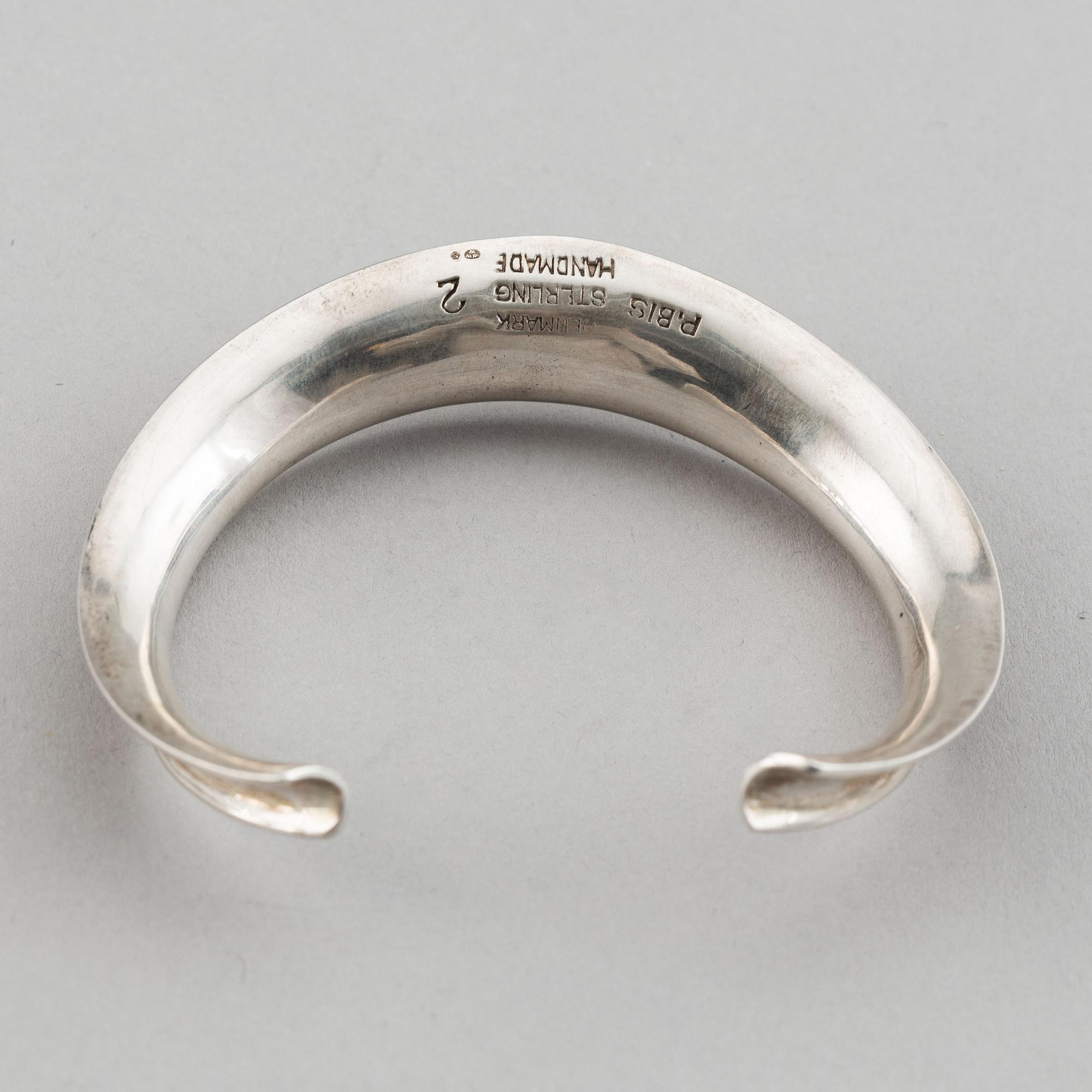 Two silver bracelets, including Denmark.