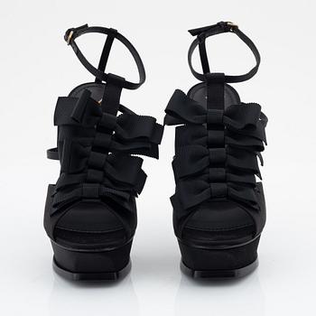 Yves Saint Laurent, a pair of black silk and bows platform sandals, size 37.