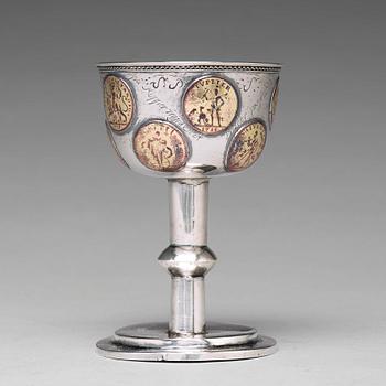 171. A Swedish 18th century parcel-gilt silver tumbler / cup, with copper coins, unmarked.