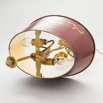 A gilt bronze bouillotte lamp for three candles, first half of the 20th century.