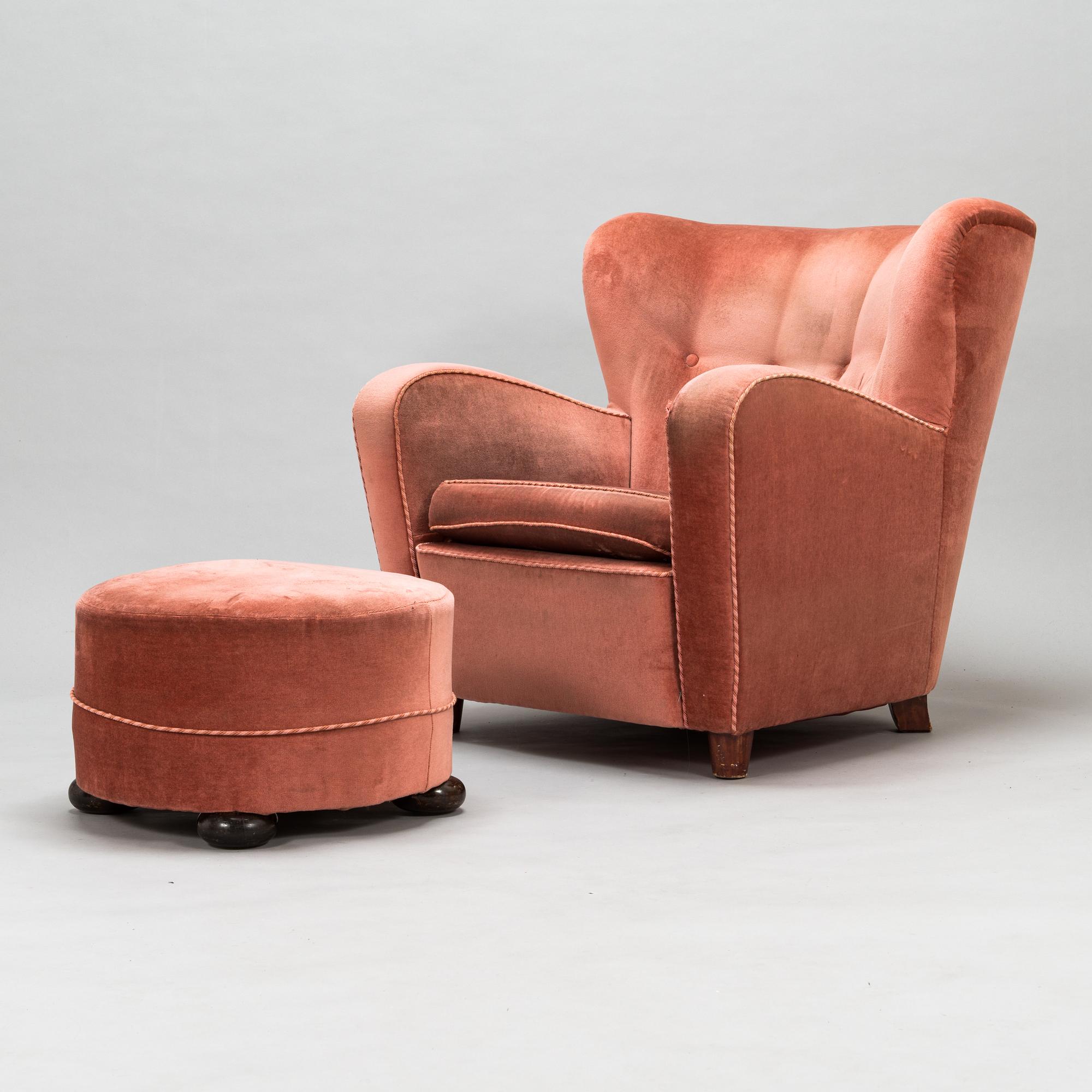 A mid-20th century armchair and ottoman.