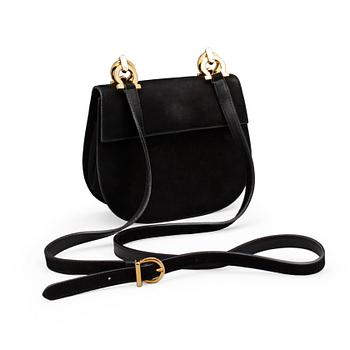 577. SALVATORE FERRAGAMO, a black suede shoulder bag.