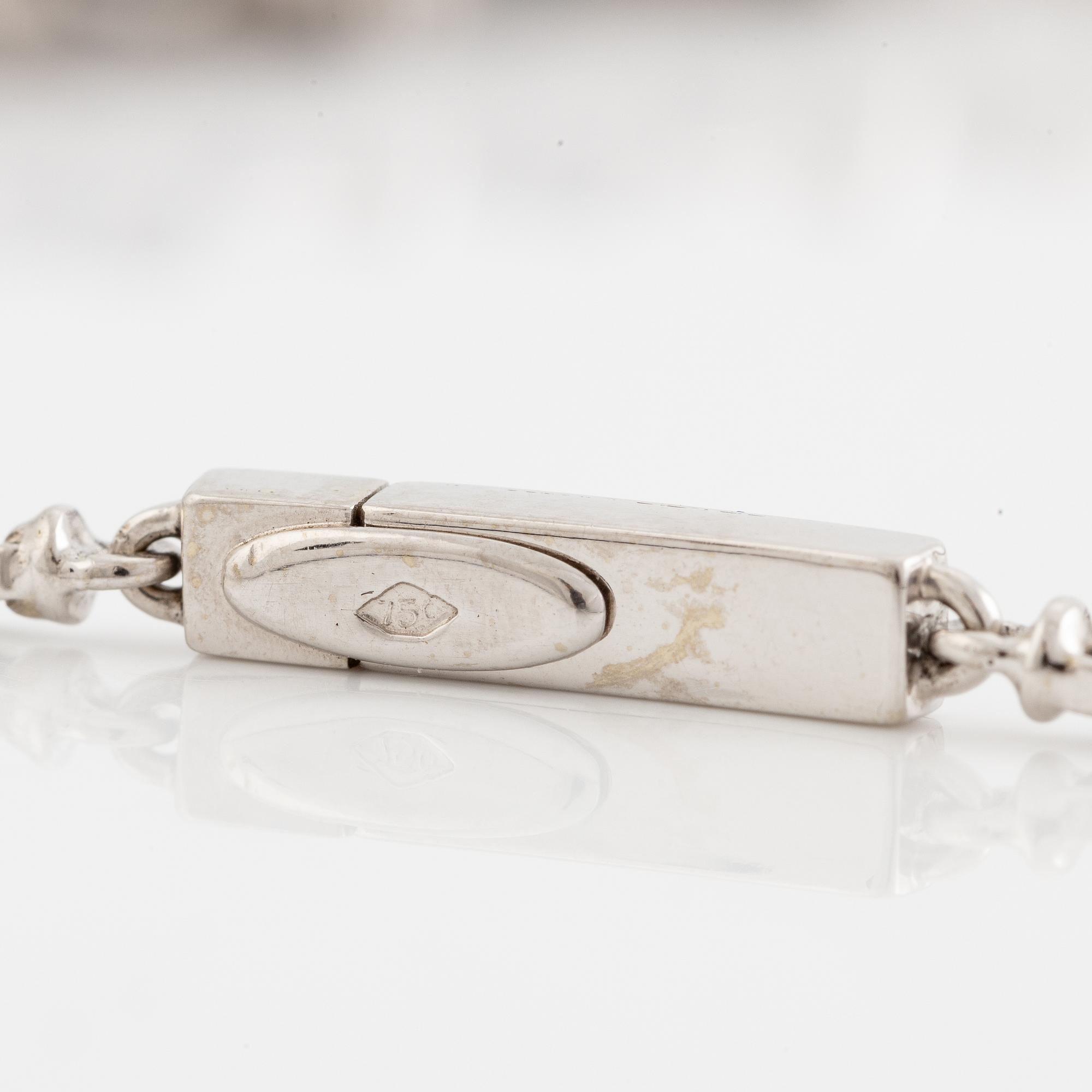 Necklace 18K white gold with step-cut sapphires and round and eight-cut diamonds.