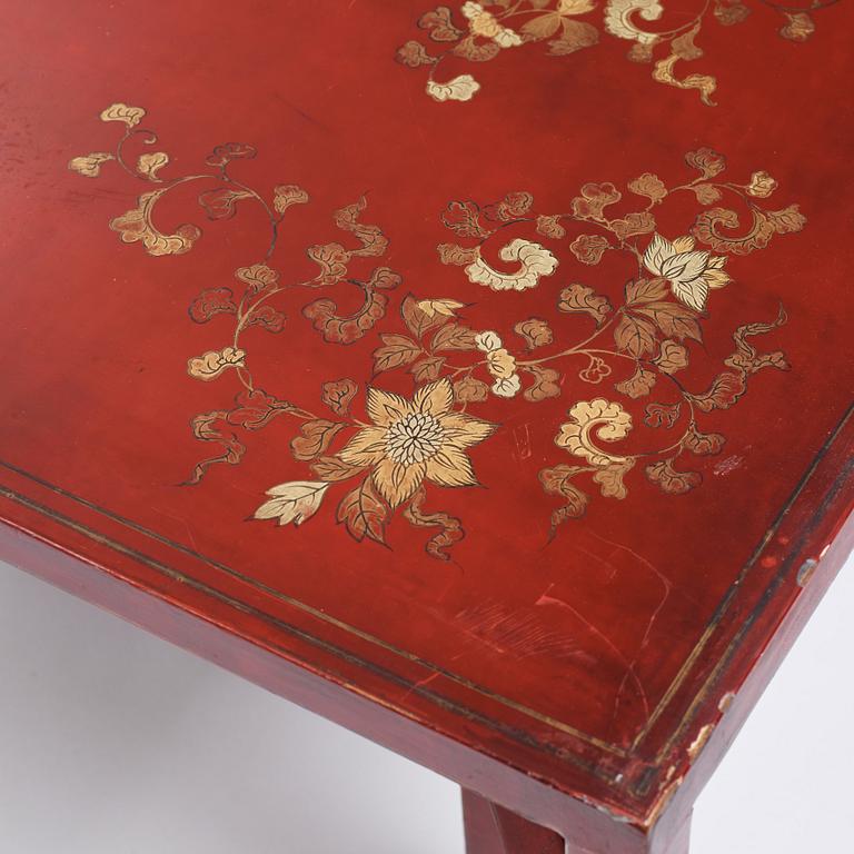 A Chinese red low table, 20th century.