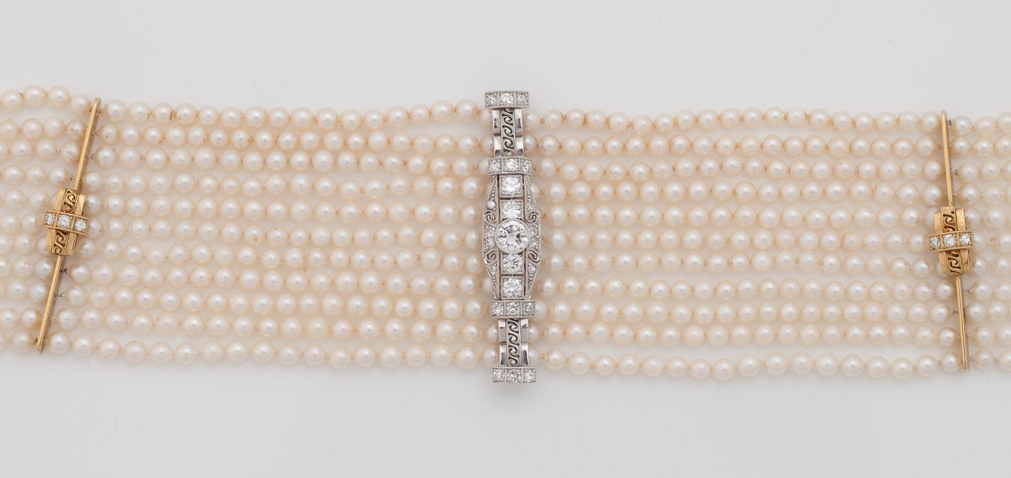 A cultured saltwater pearl and diamond choker necklace. Total carat weight 1.00 ct.