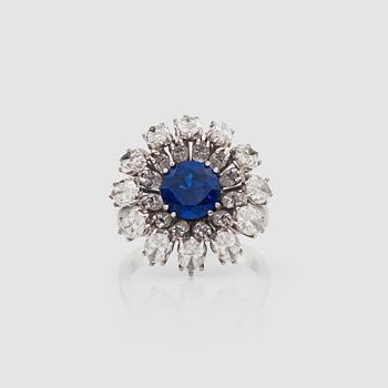 1419. A untreated sapphire, 1.75 cts, and navette-cut diamond, 4.10 cts ring.