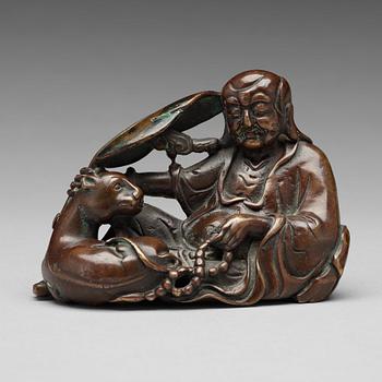 588. A bronze sculpture of one of the immortals, Qing dynasty, 18/19th Century.