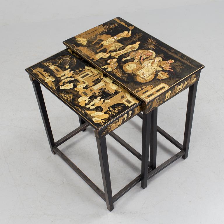 A set of two stacking tables with oriental motif, early 20th century.