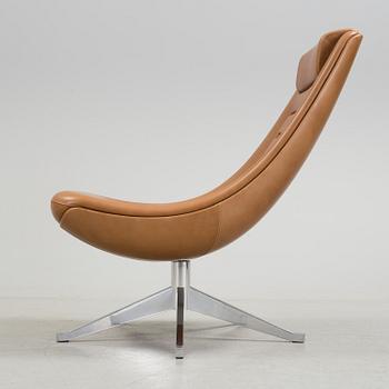 A "Manzù Lounge Chair" by Pio Manzu for Alias.