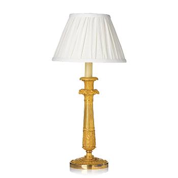 134. A French Empire ormolu bronze table lamp, early 19th century.