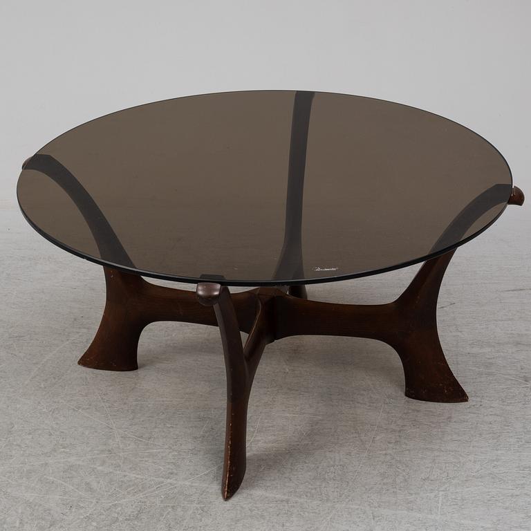 An end of the 20th Century glass top coffee table.